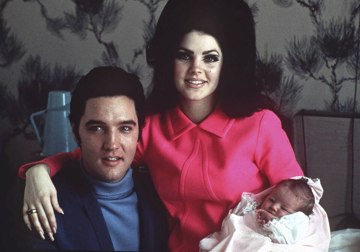 Elvis Presley poses with wife Priscilla and daughter Lisa Marie, in a room at Baptist hospital ...