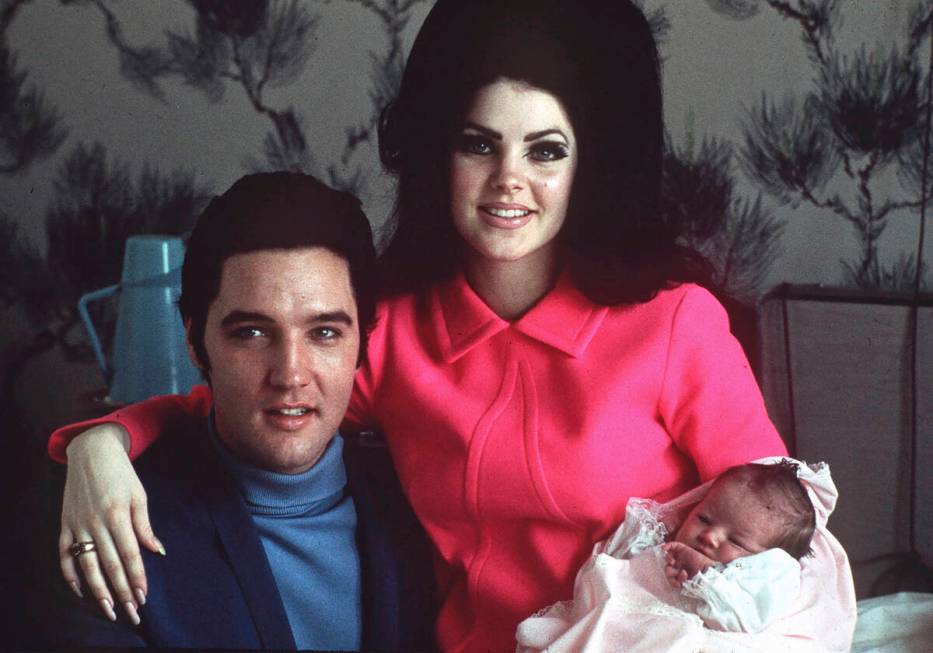 Elvis Presley poses with wife Priscilla and daughter Lisa Marie, in a room at Baptist hospital ...