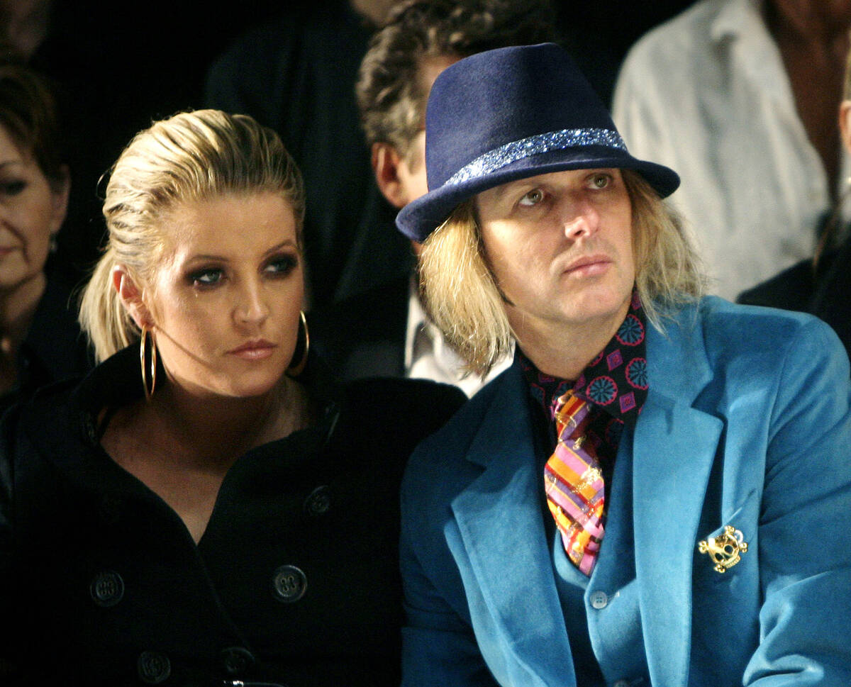 Lisa Marie Presley and her husband, Michael Lockwood, watch the Anna Sui 2008 spring/summer sho ...