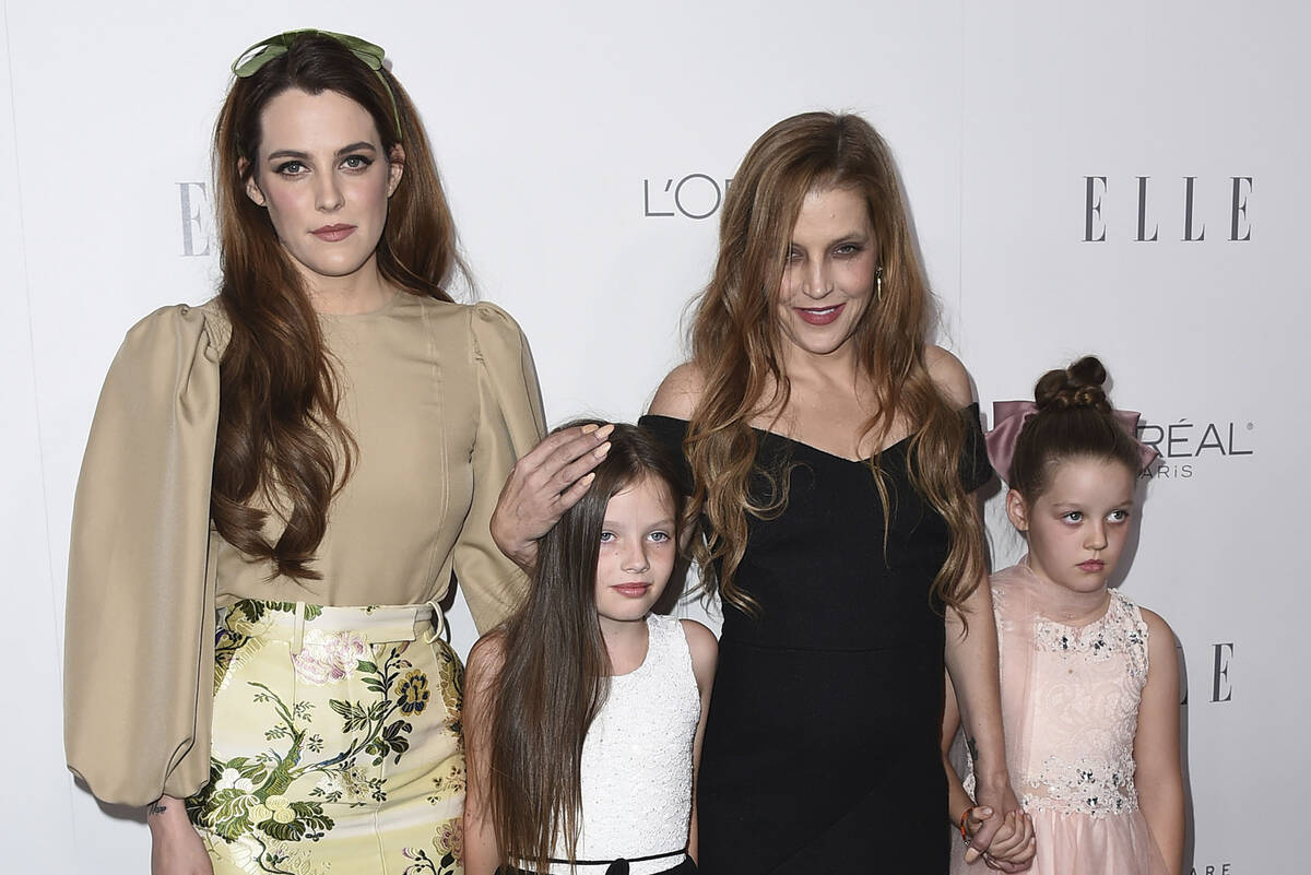 Lisa Marie Presley, second right, her daughter Riley Keough, left, and her twin daughters Finle ...