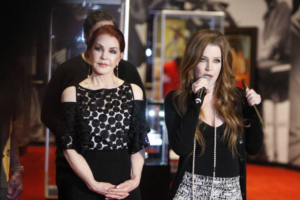 Priscilla Presley, left, listens to her daughter Lisa Marie Presley speak during a media day fo ...