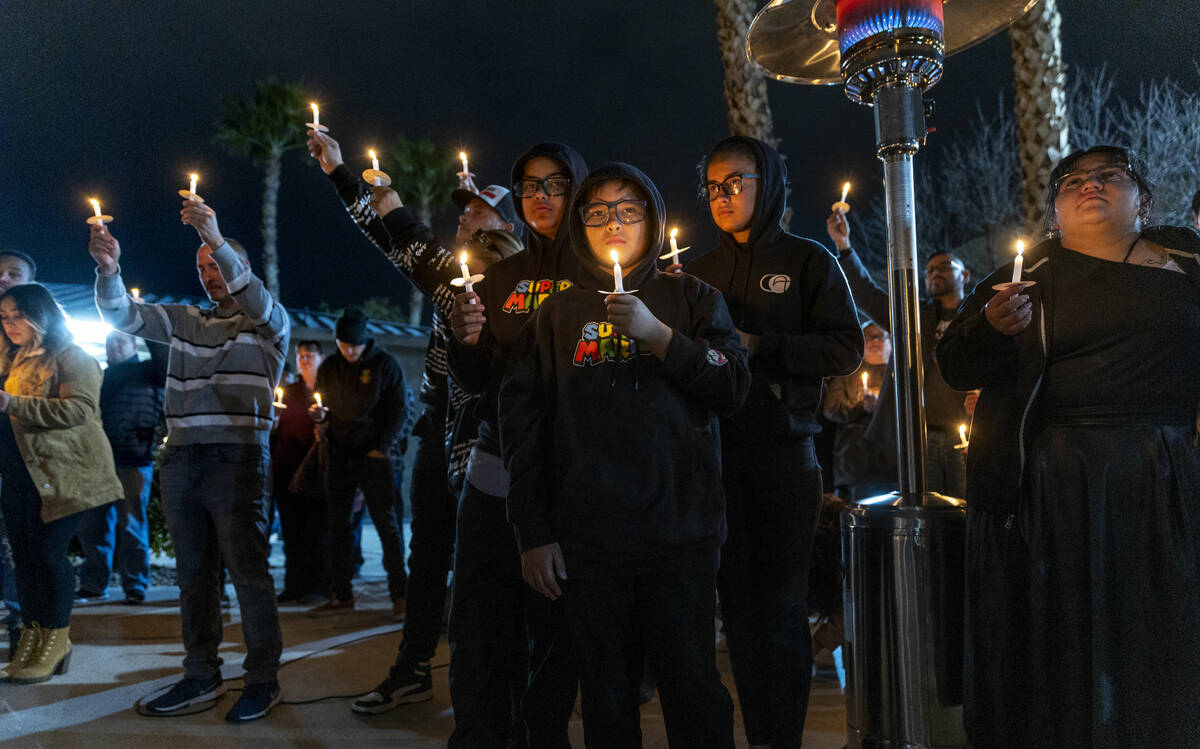 Family and friends of Jonet Dominguez honor him during a candlelight vigil at Awaken Las Vegas ...