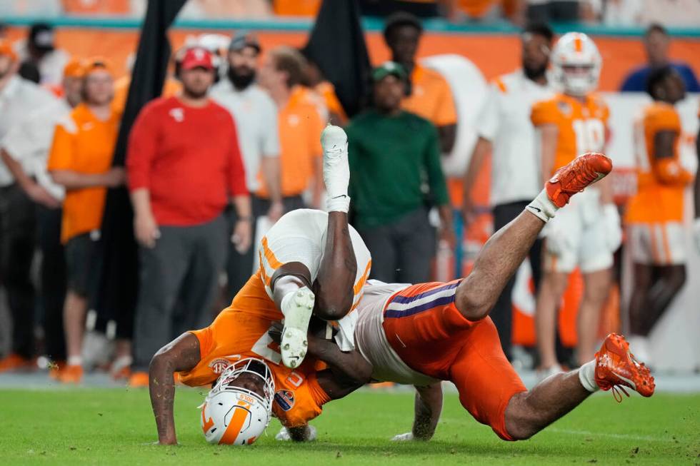 Tennessee quarterback Joe Milton III (7) is sacked by Clemson defensive tackle Bryan Bresee dur ...