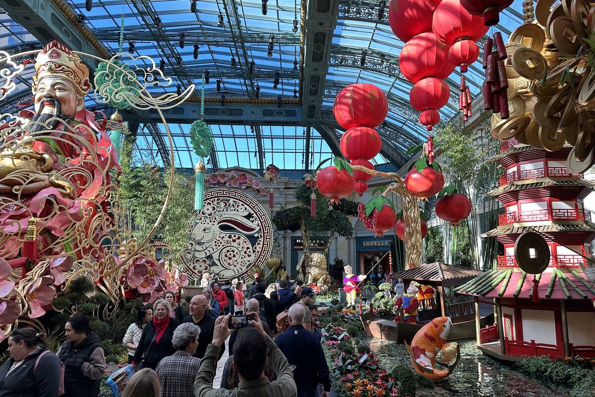 Guest walk through the Year of the Rabbit display celebrating Lunar New Year at the Bellagio Co ...