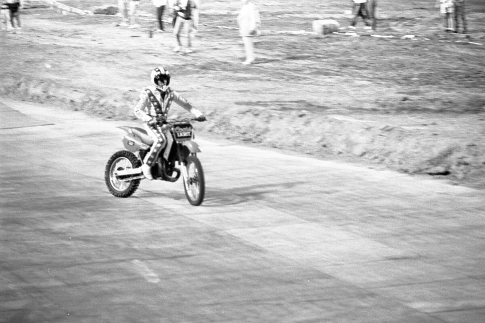 Robbie Knievel jumps his motorcycle 153 1/2 feet over 22 parked cars in May 1987 at Sam Boyd St ...