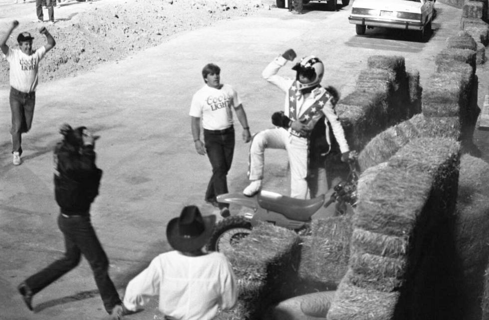 Robbie Knievel jumps his motorcycle 153 1/2 feet over 22 parked cars in May 1987 at Sam Boyd St ...