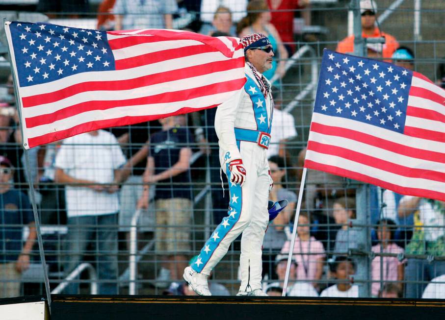 Stunt motorcycle driver Robbie Knievel is introduced on the ramp prior to making his jump over ...