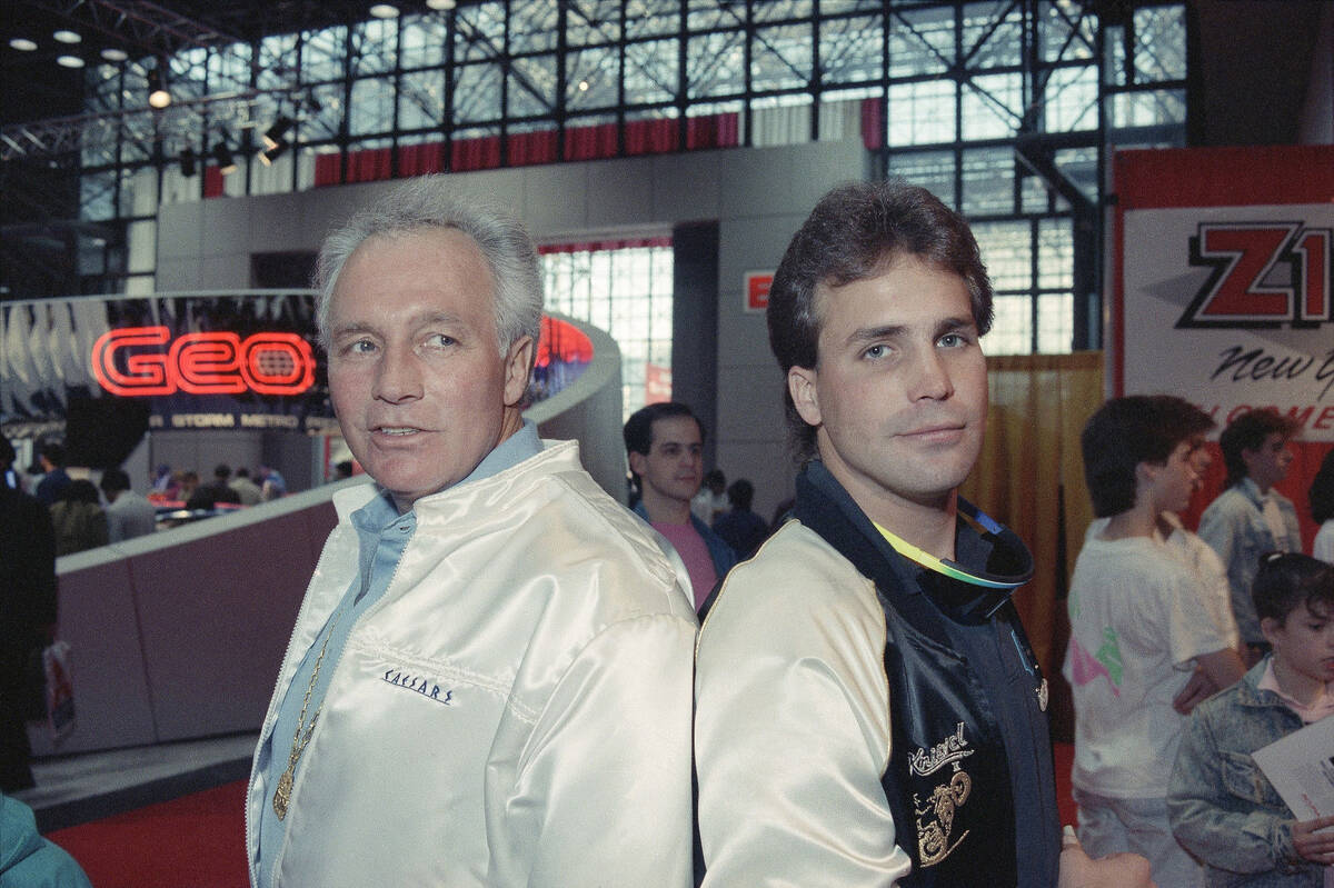 Evel Knievel poses with his son Robbie Knievel at press conference, March 1989, to announce he ...