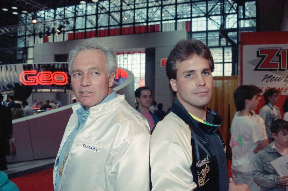 Evel Knievel poses with his son Robbie Knievel at press conference, March 1989, to announce he ...