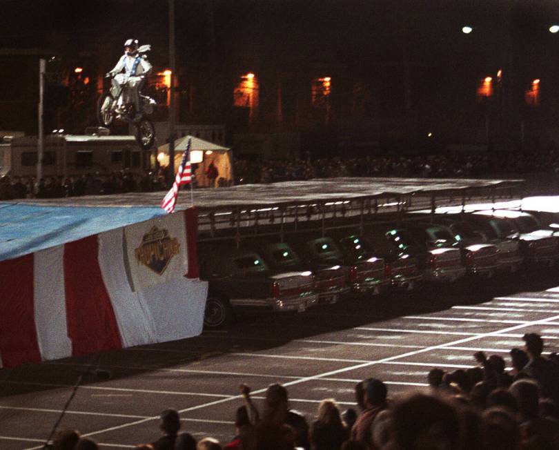 Robbie Knievel successfully lands after jumping his motorcycle over 30 limousines at the Tropic ...