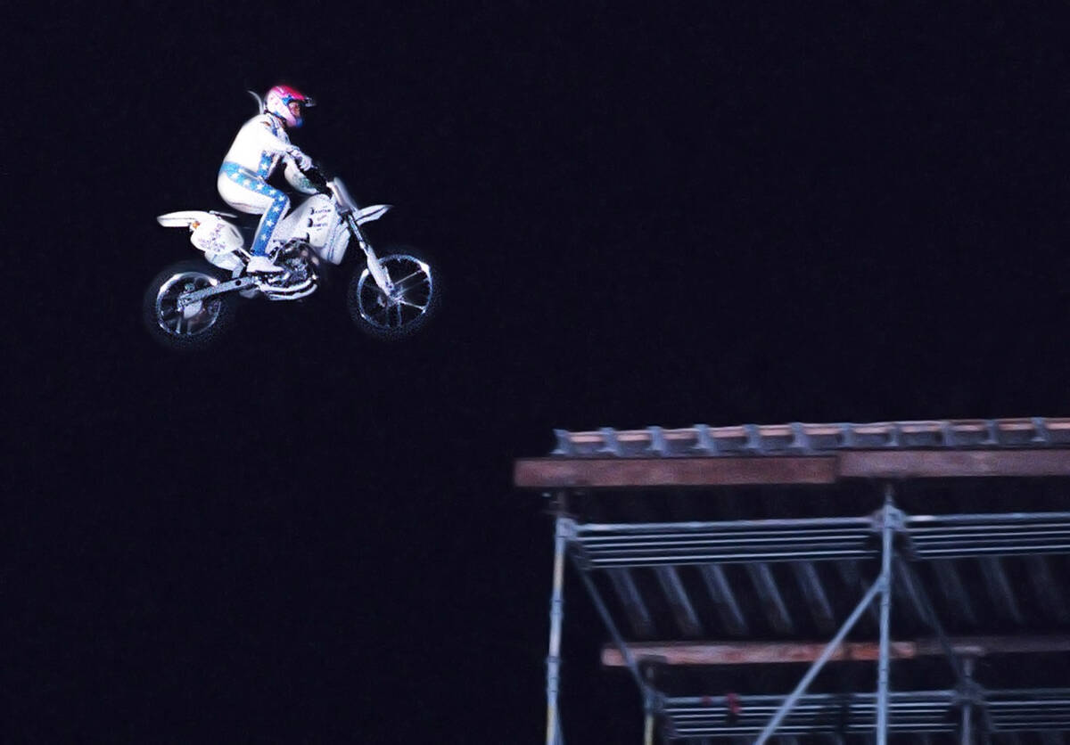 Robbie Knievel descends toward the landing ramp of his 130 foot motorcycle jump from top of the ...