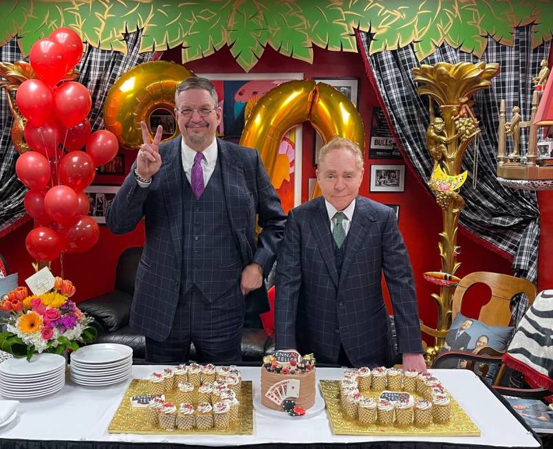 Penn & Teller enjoy an appropriately designed cupcake display marking their 30th anniversary of ...