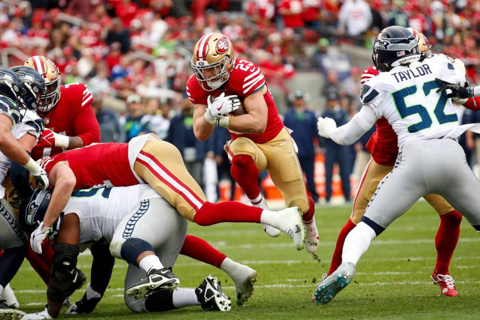 San Francisco 49ers running back Christian McCaffrey (23) runs against the Seattle Seahawks dur ...