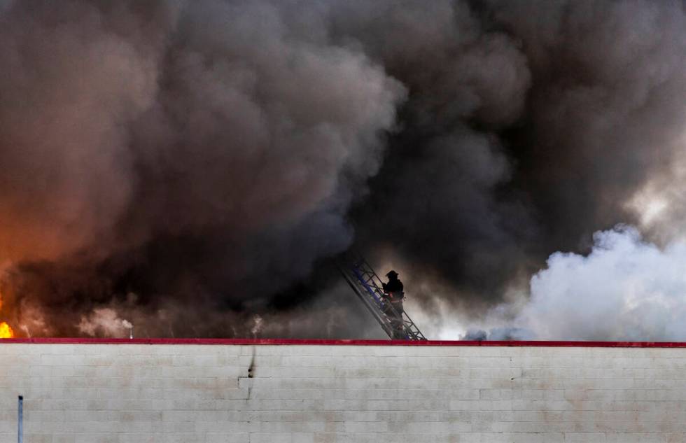 Las Vegas and Clark County Fire works a fully involved former Kmart store at 2975 E. Sahara Ave ...