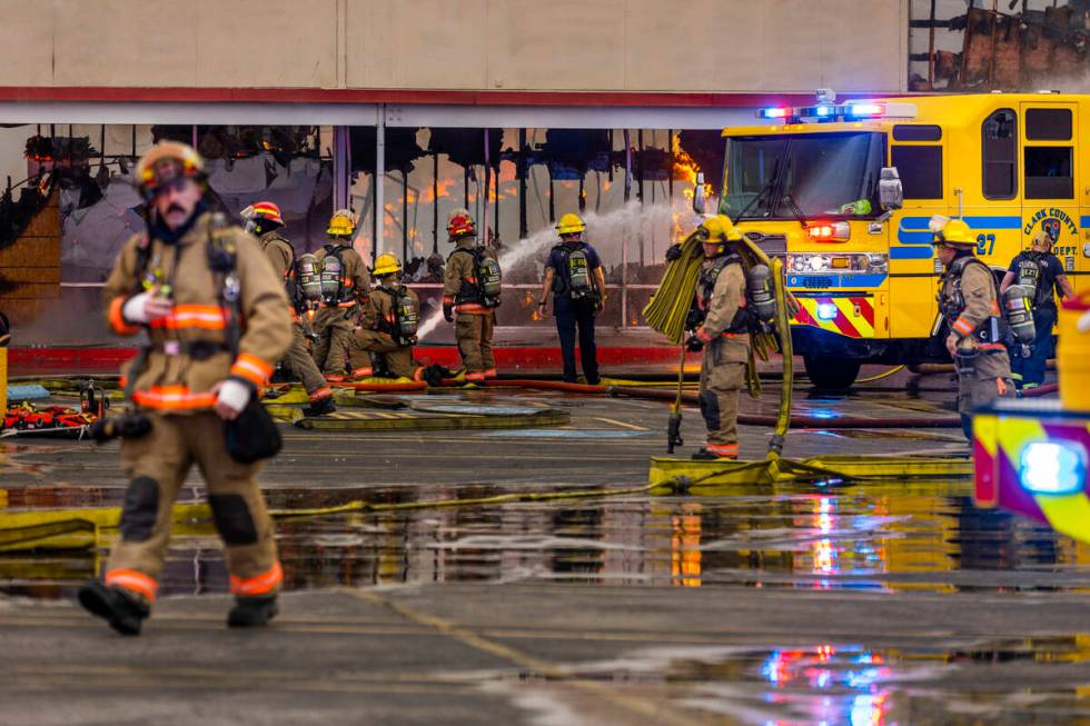Las Vegas and Clark County Firefighters work a fully involved former Kmart store at 2975 E. Sah ...