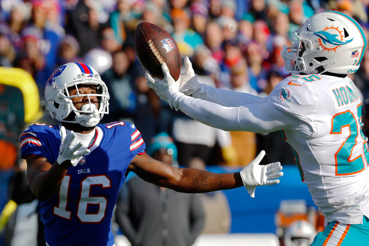 Miami Dolphins cornerback Xavien Howard (25), right, intercepts a pass intended for Buffalo Bil ...