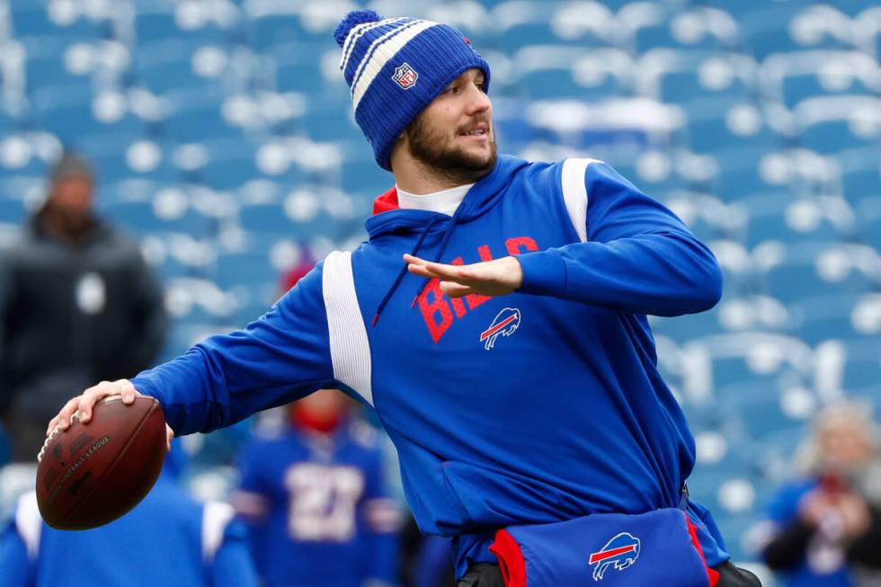 Buffalo Bills quarterback Josh Allen warms up prior to an NFL wild-card playoff football game a ...