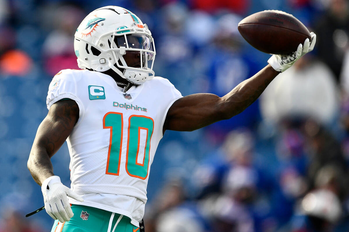 Miami Dolphins wide receiver Tyreek Hill (10) warms up prior to an NFL wild-card playoff footba ...