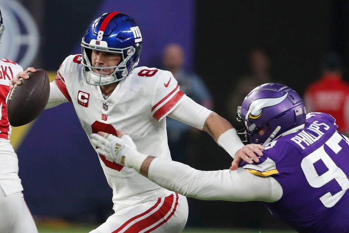 Minnesota Vikings' Harrison Phillips tries to stop New York Giants' Daniel Jones during the fir ...