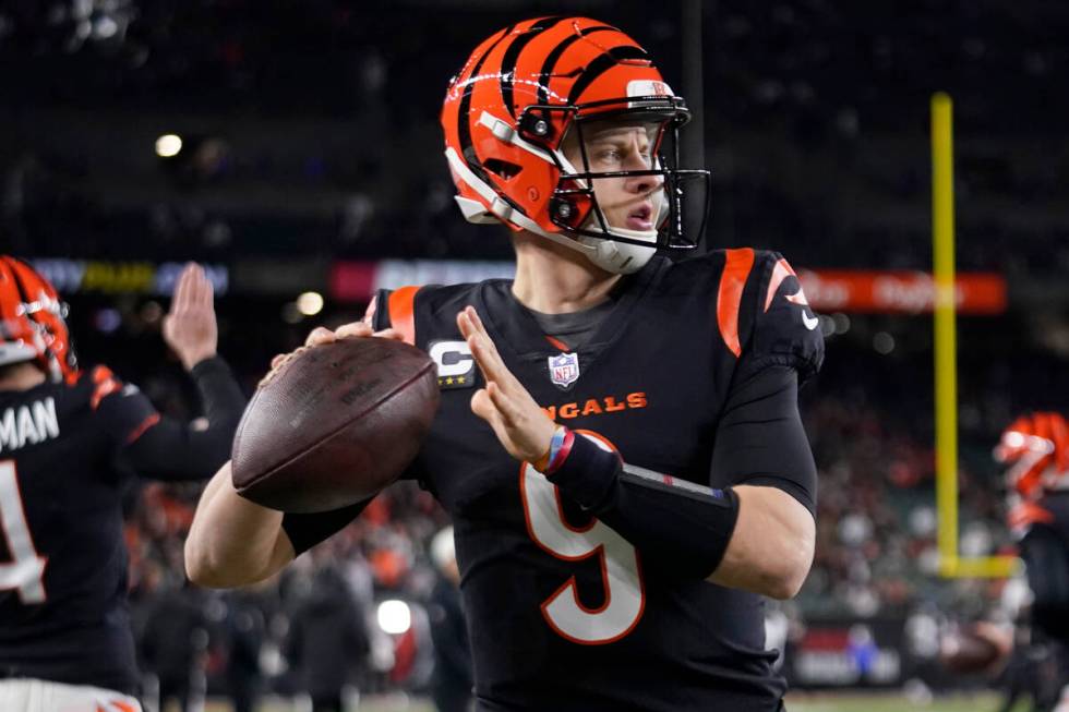 Cincinnati Bengals quarterback Joe Burrow warms up before an NFL wild-card playoff football gam ...