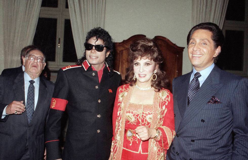 FILE - U.S. pop superstar Michael Jackson poses with Italian actress Gina Lollobrigida and fash ...