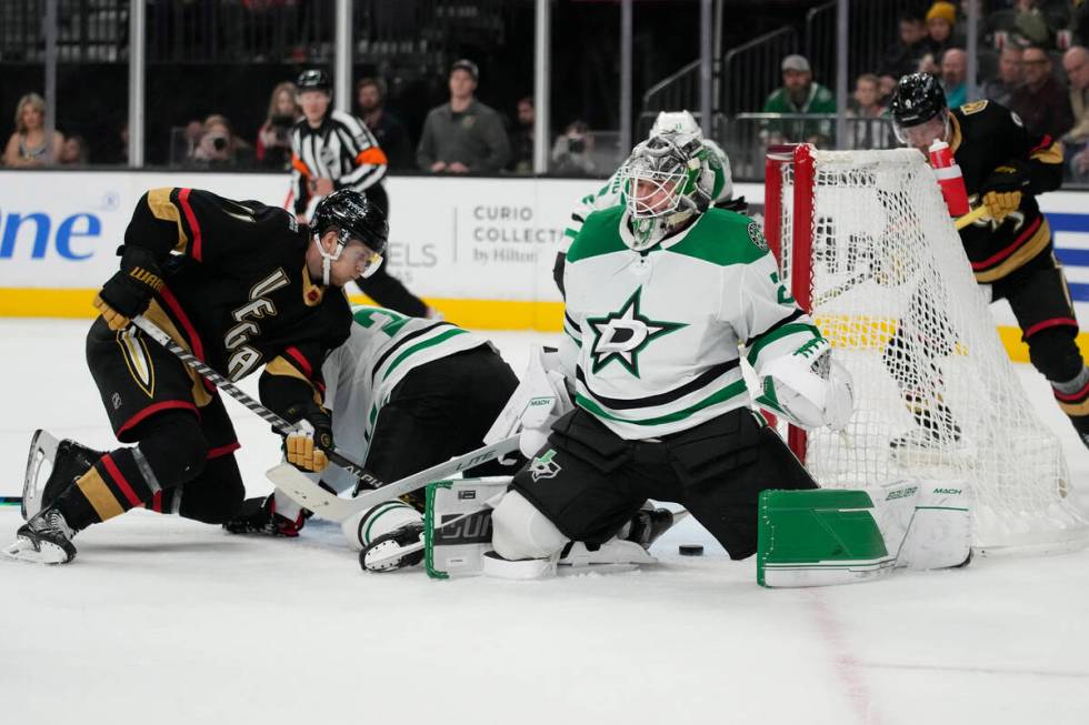 Vegas Golden Knights center William Karlsson (71) attempts to get the puck past Dallas Stars go ...