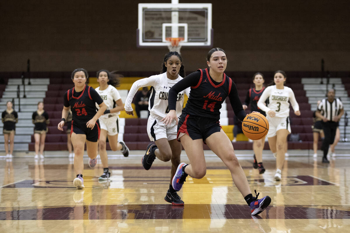 Coronado’s Kaylee Walters (14) drives toward the hoop after stealing possession from Fai ...