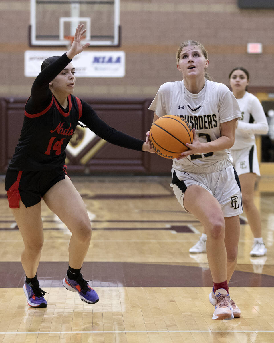 Faith Lutheran’s Raina Forgue (23) dribbles toward the hoop against Coronado’s Ka ...