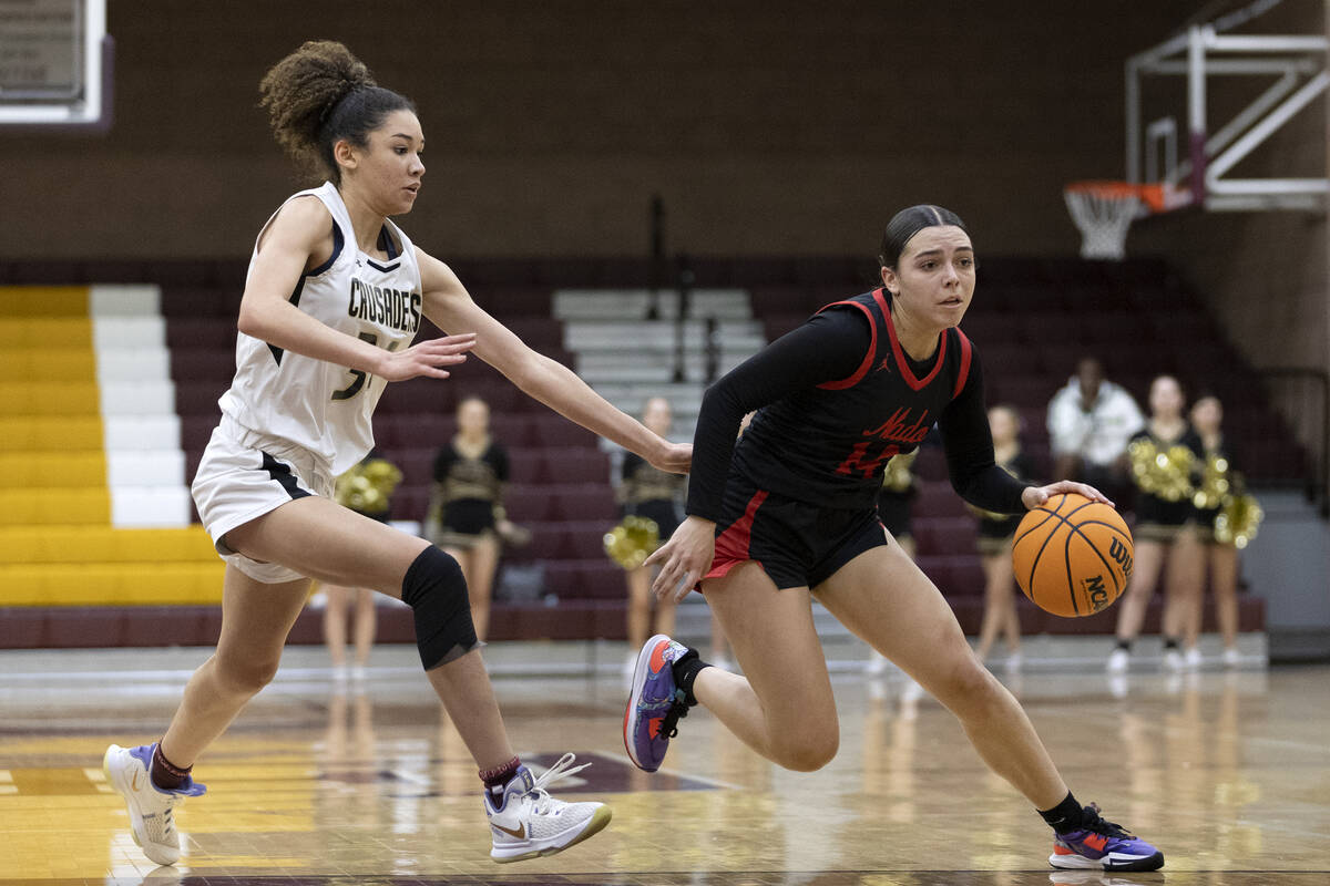 Coronado’s Kaylee Walters (14) dribbles around Faith Lutheran’s Leah Mitchell, le ...