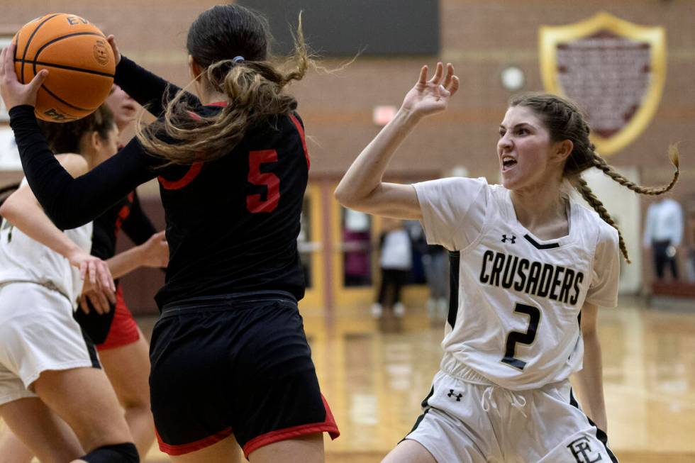 Coronado’s Scarlet Lopez (5) snags a rebound while Faith Lutheran’s Abby Blake (2 ...