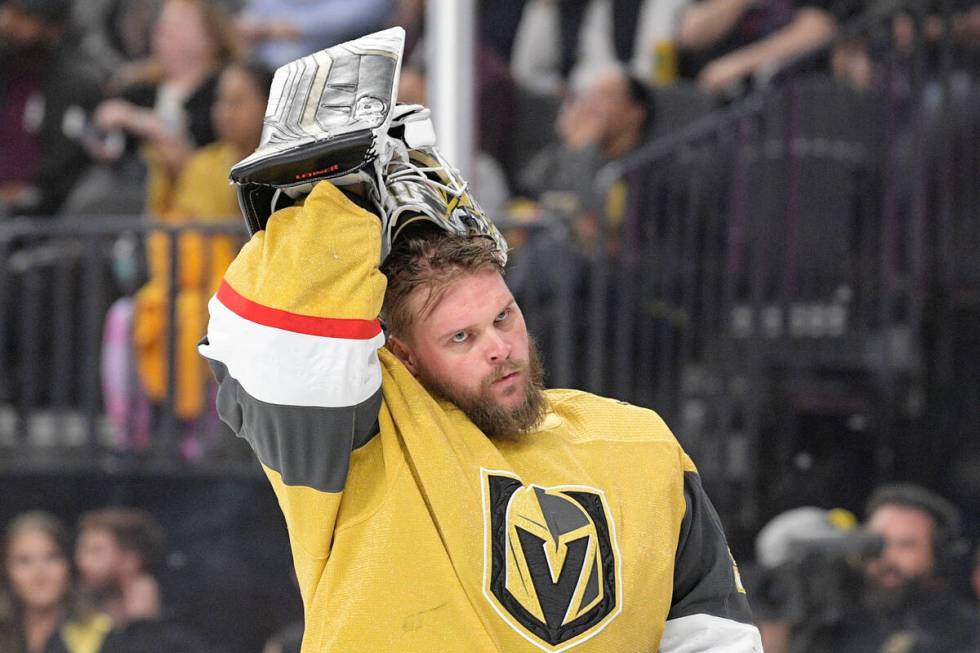 Golden Knights goaltender Robin Lehner puts his helmet on before the team's NHL game against th ...