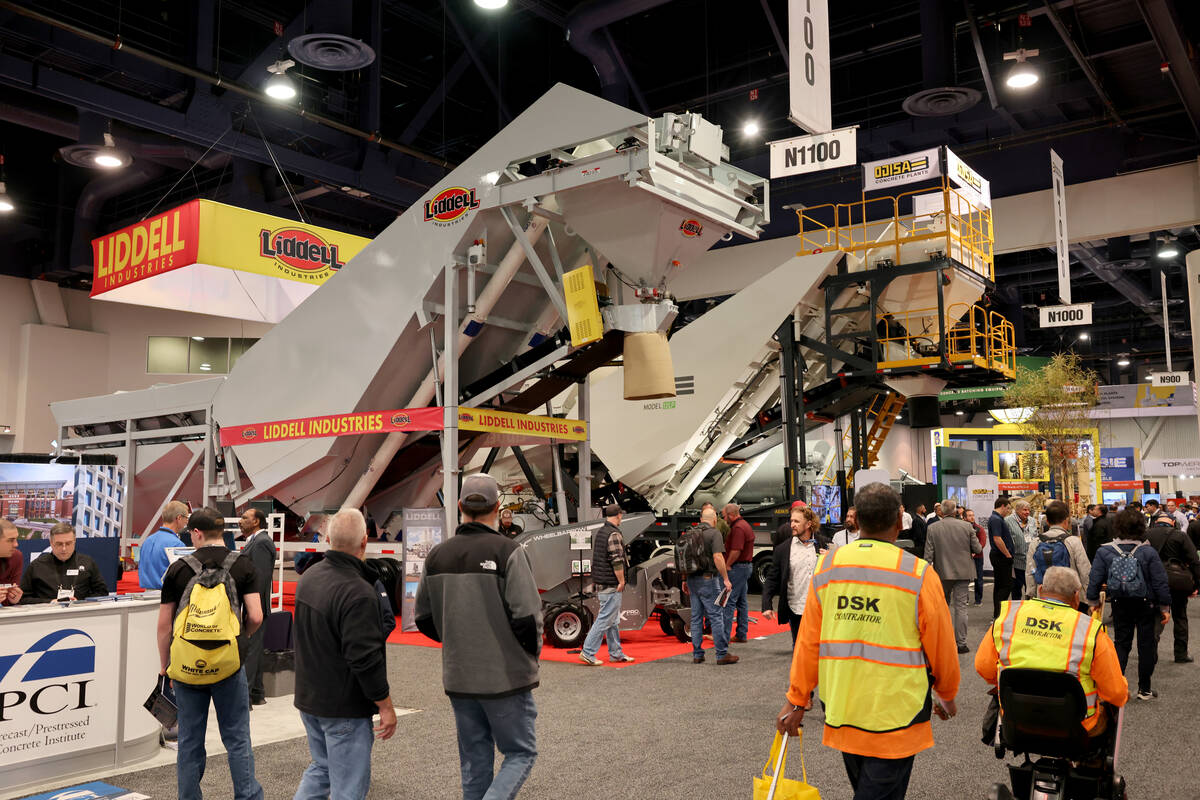 Conventioneers check out mobile concrete batch plants on Day 1 of World of Concrete at the Las ...