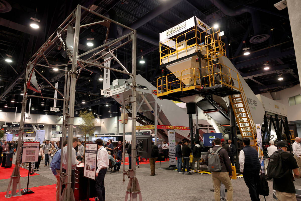Conventioneers check out mobile concrete batch plants on Day 1 of World of Concrete at the Las ...