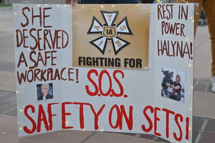 Wynema Chavez Quintana holds a sign calling for better safety on movie sets during a vigil held ...