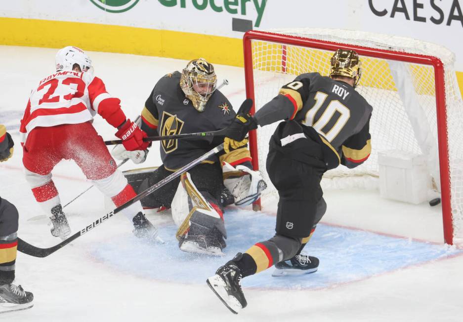 Detroit Red Wings left wing Lucas Raymond (23) scores a goal past Golden Knights goaltender Adi ...