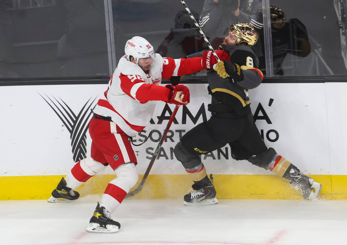 Detroit Red Wings defenseman Jake Walman (96) and Golden Knights right wing Phil Kessel (8) bat ...