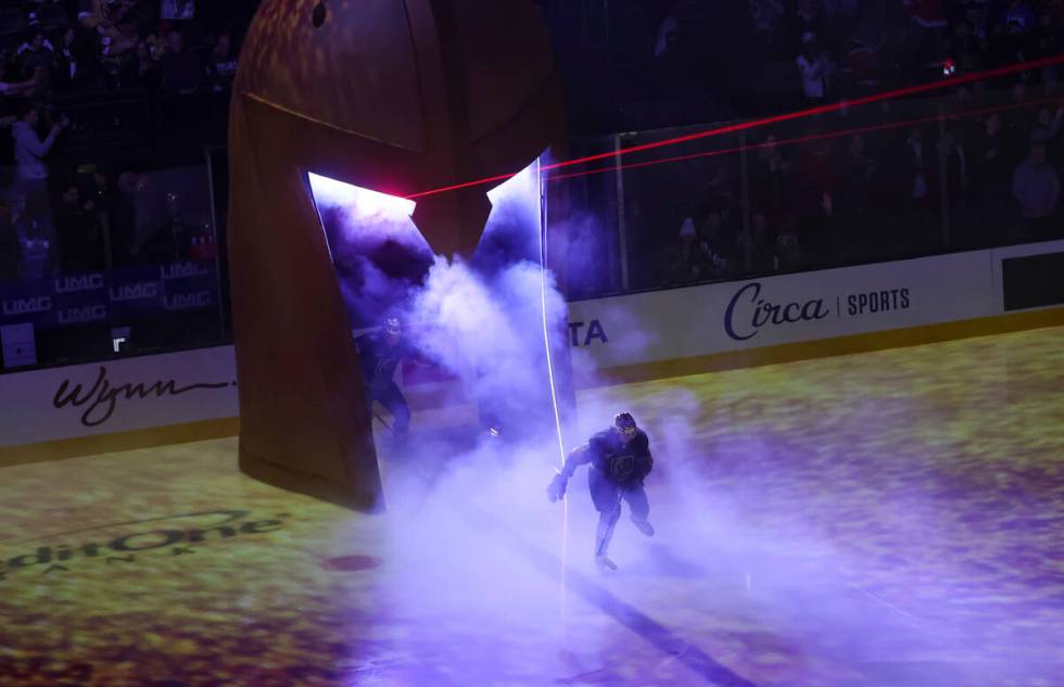 Golden Knights defenseman Kaedan Korczak (6) skates onto the ice before an NHL hockey game agai ...