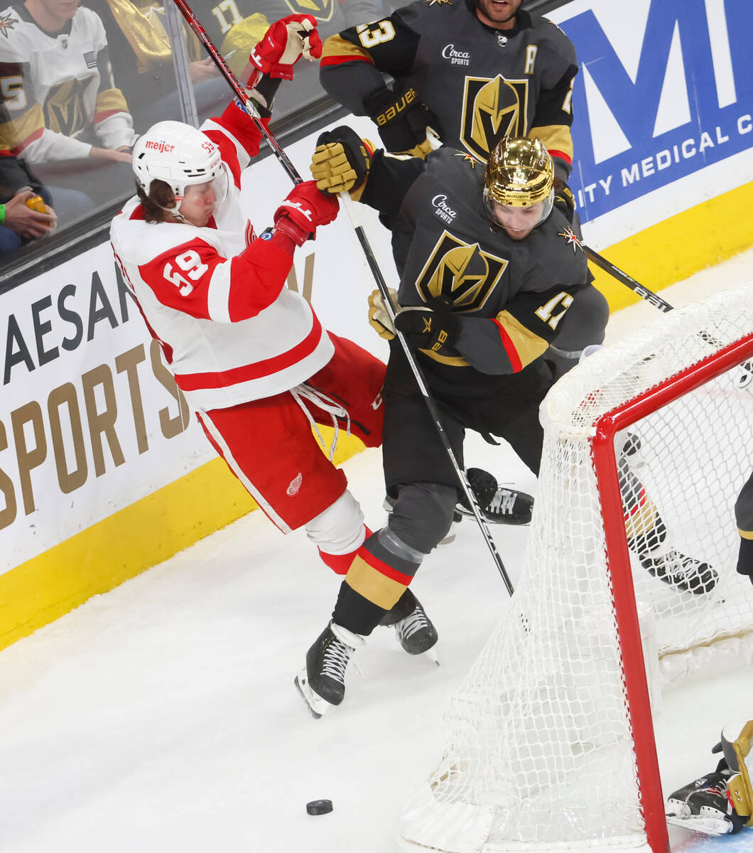 Detroit Red Wings left wing Tyler Bertuzzi (59) and Golden Knights defenseman Ben Hutton (17) f ...