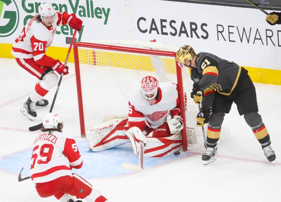 Detroit Red Wings goaltender Ville Husso (35) stops a shot by Golden Knights center Byron Froes ...