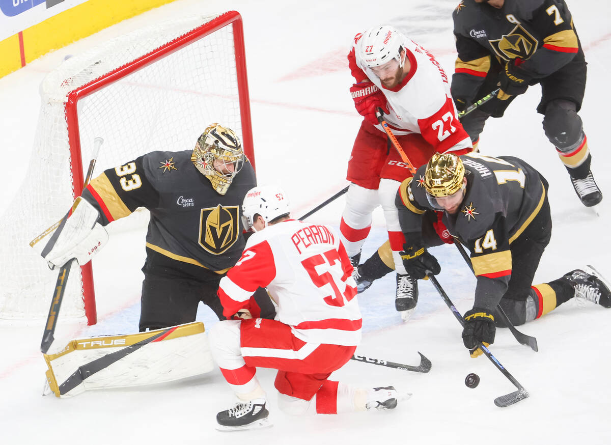 Golden Knights goaltender Adin Hill (33) blocks a shot from Detroit Red Wings left wing David P ...