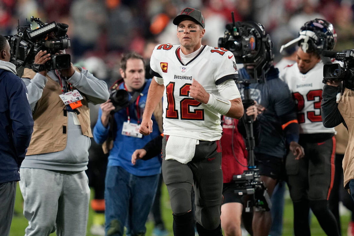 Tampa Bay Buccaneers quarterback Tom Brady (12) leaves the field after an NFL wild-card footbal ...