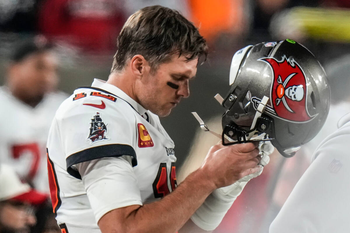 Tampa Bay Buccaneers quarterback Tom Brady (12) walks on the sidelines during the second half o ...