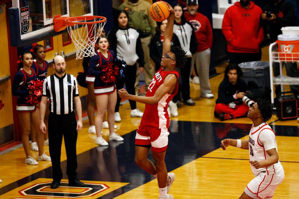 Liberty’s Javares Reid (22) shoots the ball as Coronado’s Tee Bartlett, right, lo ...