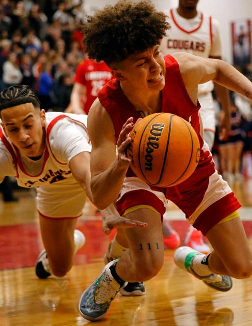 Liberty’s Angelo Kambala, right, drives past Coronado’s JC Brooks during the firs ...