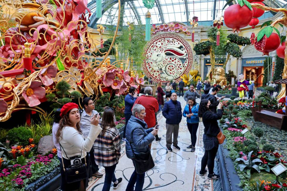 Guests take in the Year of the Rabbit display celebrating Lunar New Year at the Bellagio Conser ...