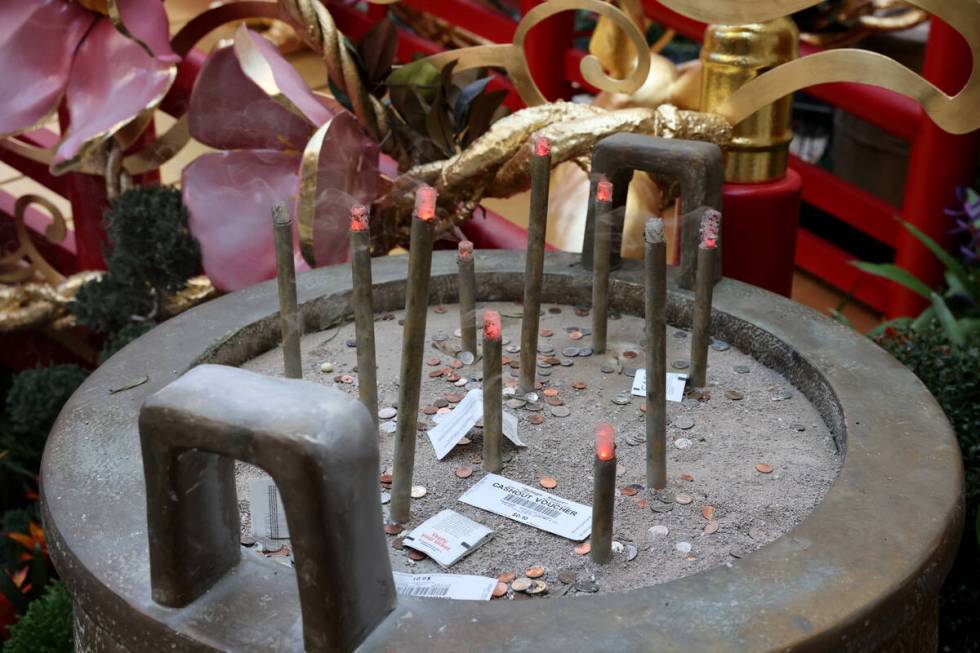 Simulated incense in a ding pot is part of the Year of the Rabbit display celebrating Lunar New ...