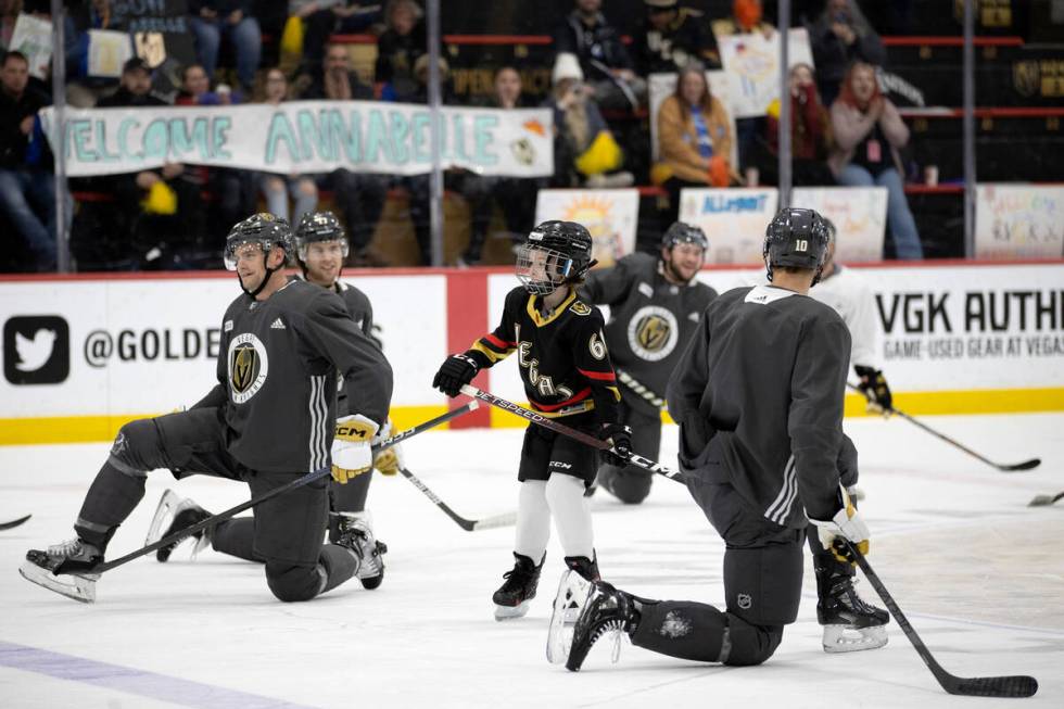 Annabelle Hanson of Janesville, Calif., 8, joins the Golden Knights on the ice during practice ...