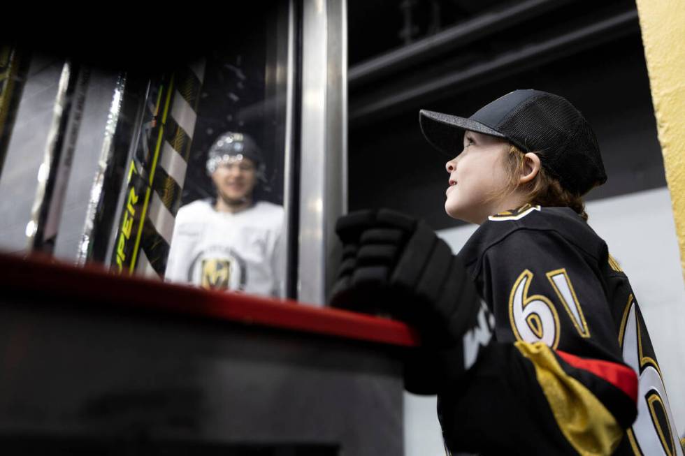 Annabelle Hanson, 8, greets Golden Knights center William Karlsson during practice City Nationa ...