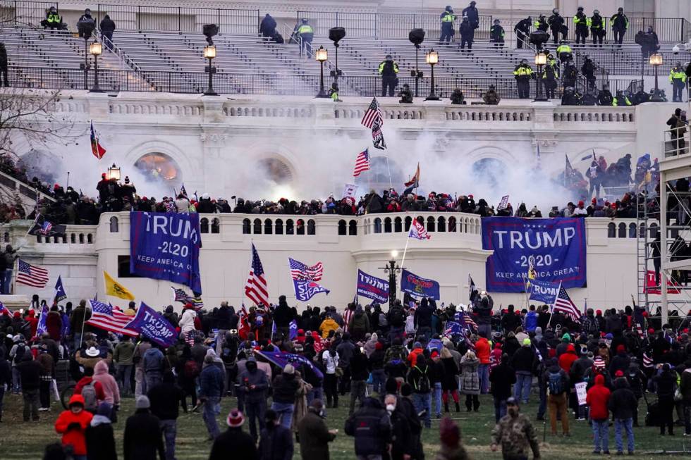 FILE - Insurrectionists loyal to President Donald Trump, storm the Capitol, Wednesday, Jan. 6, ...