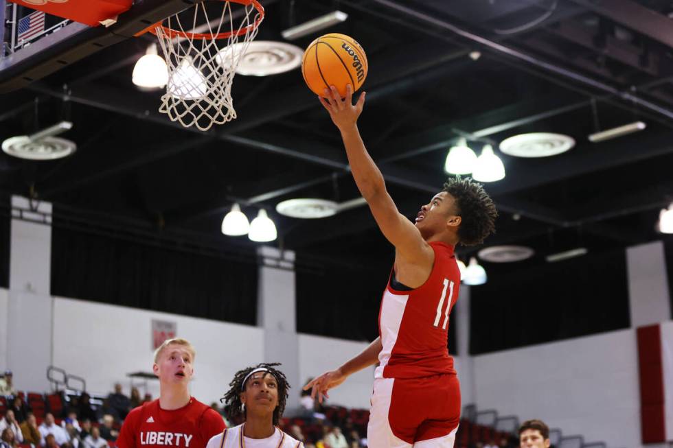 Liberty's Dedan Thomas (11) takes a shot in the first half of a Big City Showdown boy's basketb ...